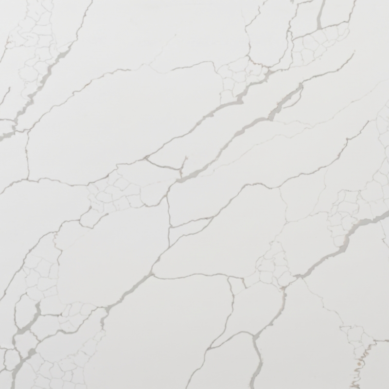 a clean white quartz slab with soft grey fracture-style veining for countertops