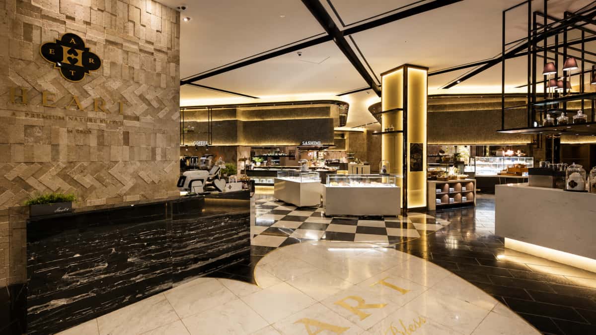 Installed hotel marble entrance floor with heart-shaped inlay and checkerboard pattern
