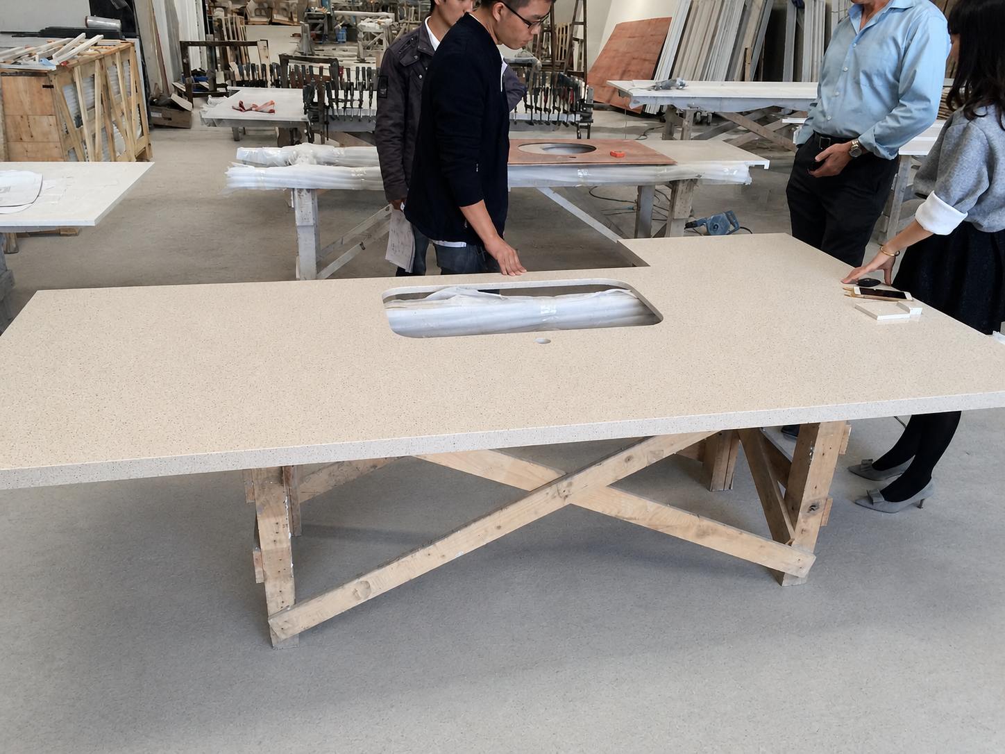 Aoli Stone team inspecting fabricated quartz vanity countertops for a U.S. multifamily project