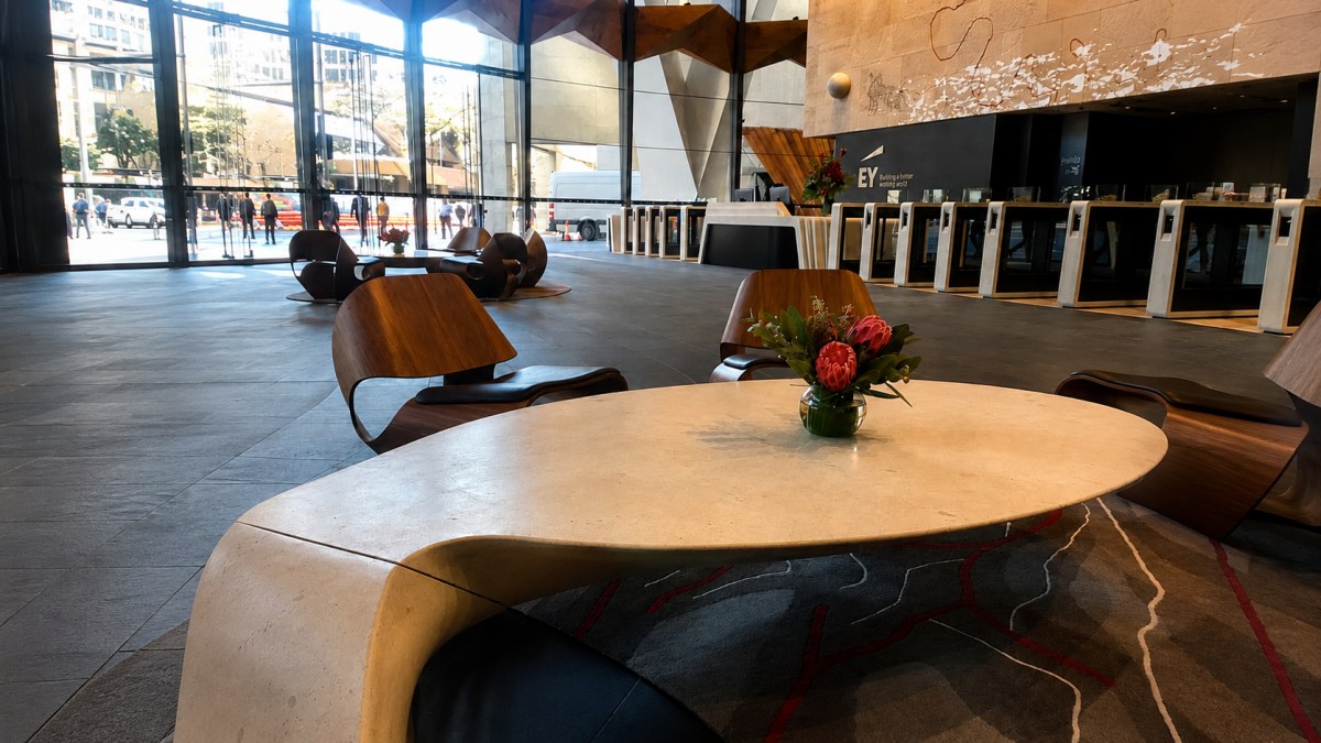 French-Limestone-Sculptural-Table-Lobby-Application Custom French limestone sculptural table used in a commercial lobby interior