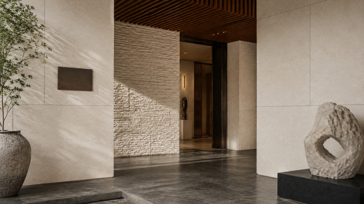 Cotswold Cream Limestone wall cladding used in a contemporary courtyard entrance with warm metal details