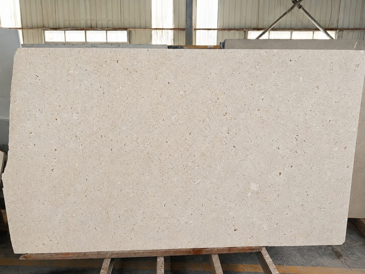 Cotswold Cream Limestone Raw Slab with Natural Edge Raw Cotswold Cream limestone slab with warm cream beige tone, natural irregular edge, fine fossil texture, small pores, and subtle color variation