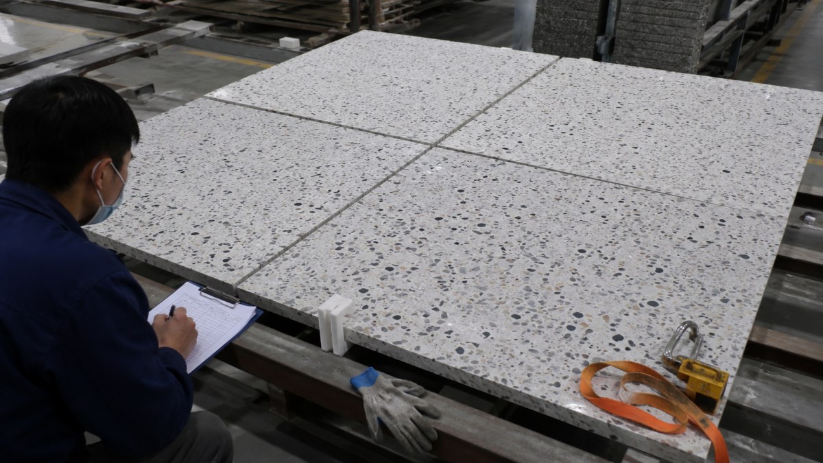 terrazzo-batch-control-and-spare-material-review Terrazzo slabs from the same batch reviewed for color consistency and spare material planning