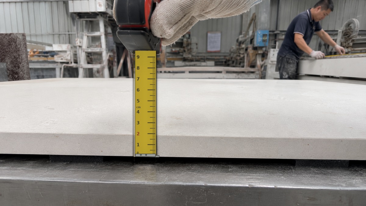 Actual cut-to-size limestone panels showing edge and thickness checks
